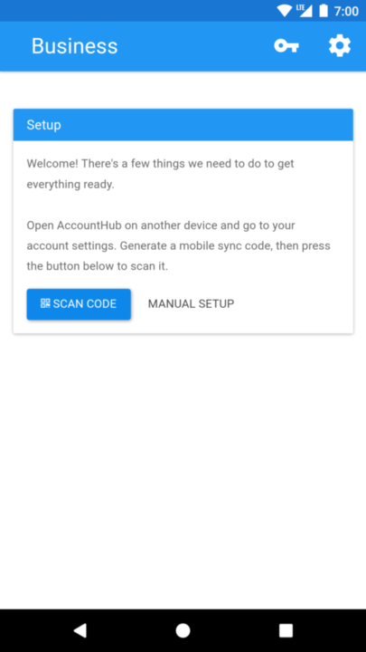 Image of phone screen showing mobile app with button labeled 'Scan Code' and button labeled 'Manual Setup'.